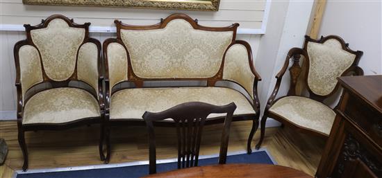 An Edwardian mahogany three piece drawing room suite sofa W.120cm